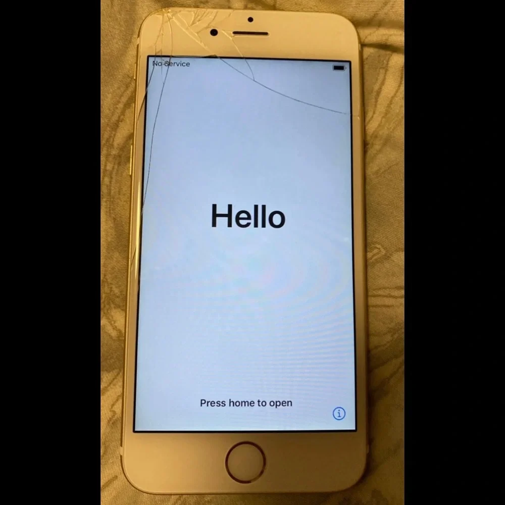 Apple iPhone 6s 32GB gold tone cell phone. Has cracked screen but still works.